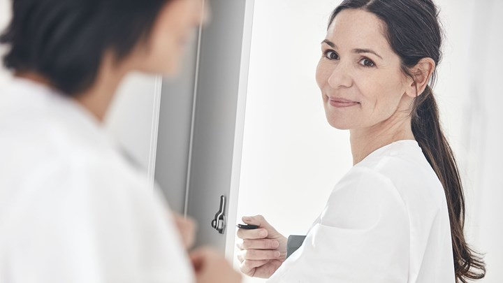 two female physicians in a changing room